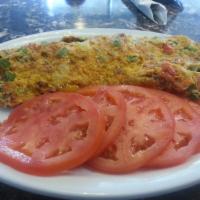 Mexican Omelet · Served with homemade chorizo, peppers, jalapeños, onions, tomatoes & cheddar cheese.