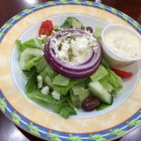Greek Salad · Romaine, lettuce topped with crumbled feta cheese, stuffed grape leaves, Kalamata olives, pe...