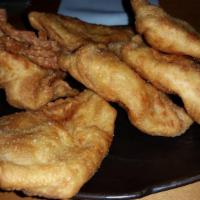 Crab Rangoon · 6 pieces. Deep-fried combination of cream cheese and crabmeat.