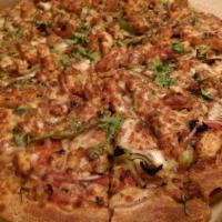 Indian Style Tandoori Chicken Pizza · Marinated chicken with red onions, green peppers, mushrooms, chili peppers, ginger with toma...