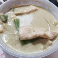 Green Curry · Coconut milk with zucchini, bamboo shoots, bell peppers, green beans and basil leaves in gre...