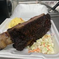 Brisket and Pork Ribs Plate · Served with Two sides. 
Barbecue on side - Bread, Pickles and onions upon request