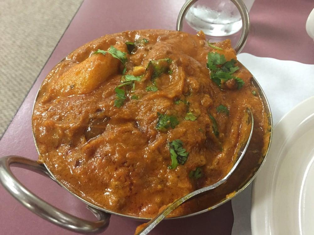 Lamb Vindaloo · Boneless leg of lamb cooked with potatoes and chilies in mughlai sauce. Served with basmati rice. Hot.
