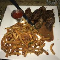 Hanger Steak Frites · Served with truffle fries.