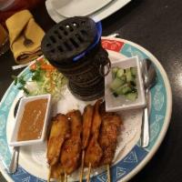 Satay · Sliced chicken or beef on skewers, marinated in coconut milk blended with yellow curry, gril...
