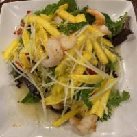 Grilled Shrimp Mango Salad · Grilled marinated shrimp on skewers served with mango, young papaya, cilantro, red bell pepp...