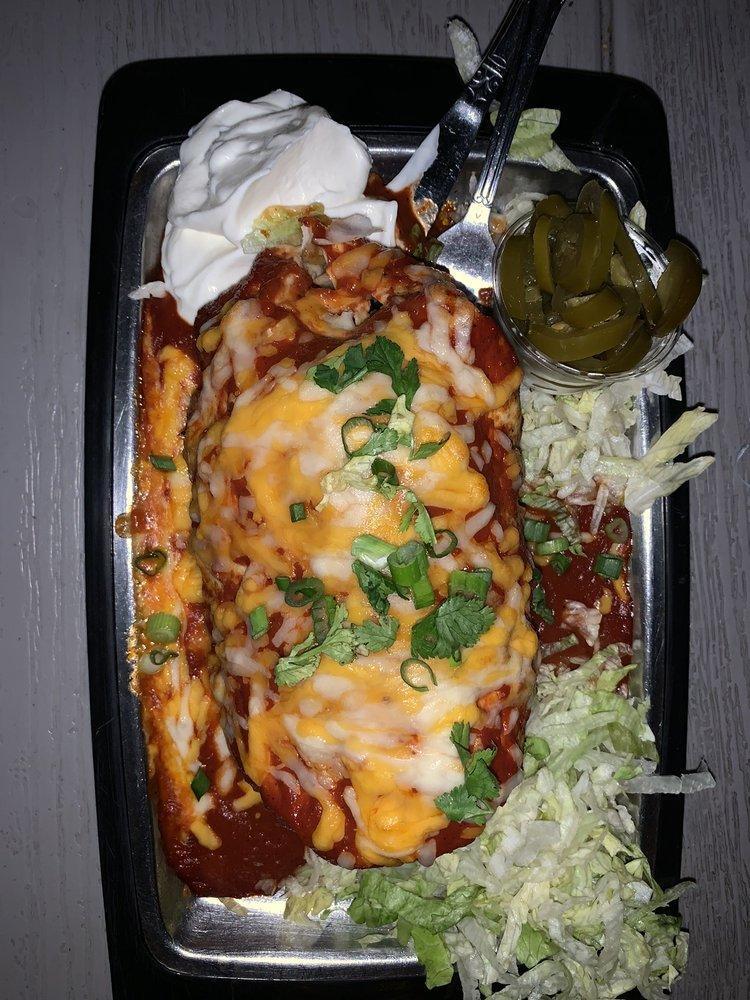 Wet Burrito · Black beans, brown rice, roasted red peppers, shredded cheddar Jack cheese, tomatoes and lettuce all wrapped in a flour tortilla, then baked to perfection and served with sour cream, pickled jalapenos, green onions, lettuce and fresh cilantro. Topped with your choice of red chili sauce or beer cheese queso. Vegetarian. 