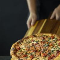 Margherita Pizza · Red sauce, fresh mozzarella, basil, grape tomatoes, and spin blend cheese.