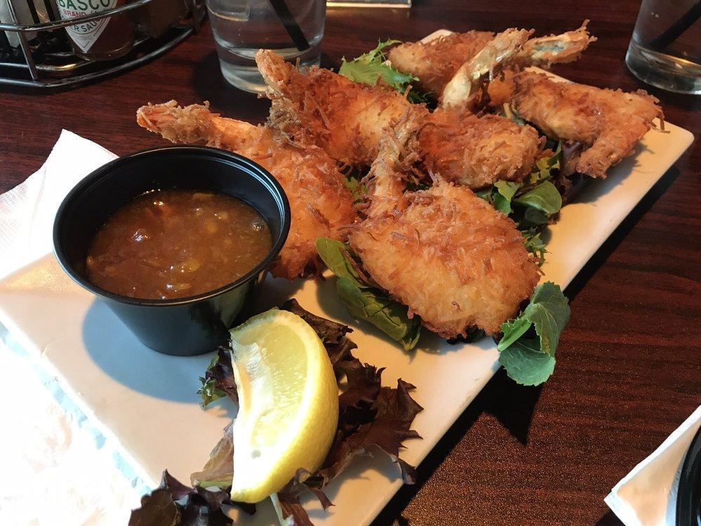 Coconut Shrimp · Jumbo gulf shrimp lightly breaded in coconut, golden fried and served with orange marmalade dipping sauce.