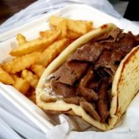 Gyros Pita · Thinly sliced layers of seasoned beef & lamb broiled on a vertical skewer with onions, tomat...
