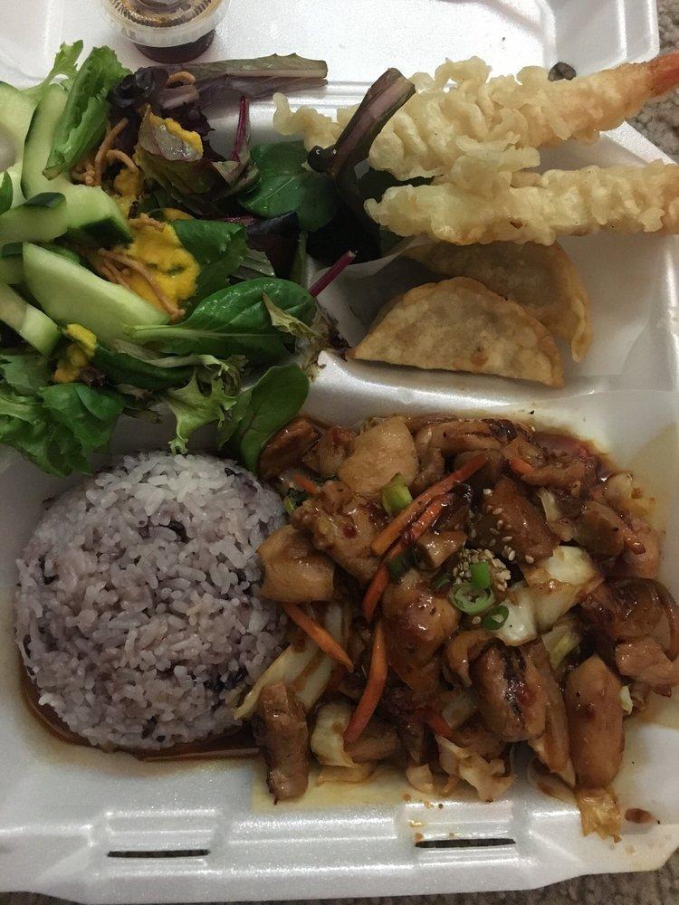 Spicy Chicken Bento · Chicken stir fried in a spicy sauce with onion, broccoli, cabbage and carrots. Served with a scoop of rice, side salad, cucumber salad, 2 potstickers, 2 shrimp tempura. 