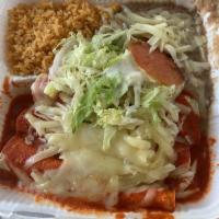Enchiladas · 3 tortillas stuffed and rolled with chicken, beef, or cheese, and topped with red or green s...