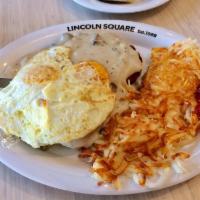 Country Lady · Golden brown country-fried steak topped with homemade sausage gravy, served alongside two eg...