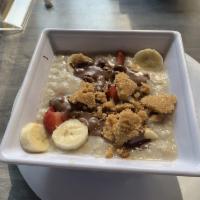 Mostly Healthy Oatmeal · Oatmeal, candied pecans, nutella, sliced bananas and strawberries.