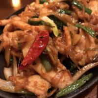 Sizzling Mongolian Chicken · Stir fried chicken with scallion, onion in a brown sauce. White meat. Hot and spicy.