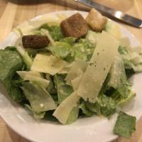 Caesar Salad · Crisp romaine lettuce and croutons with Parmesan cheese.