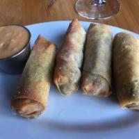 Cheesesteak Spring Rolls · Tender, thick, juicy steak, and cheese roll. Served with a spicy ketchup and mayonnaise dip.
