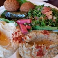 Vegetarian Plate · Hummus, baba ghannouj, tabouli, falafel, grape leaves and pickles.