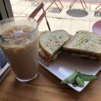 Avocado Pesto Sandwich · Avocado, mozzarella, cucumber, sprouts, tomato, romaine and pesto on toasted sourdough.