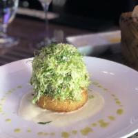 Shaved Brussel Sprouts Salad · Parmesan risotto cake, truffle vinaigrette.