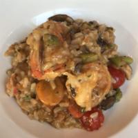 Seafood Risotto · Lobster, shrimp, scallops, salmon, scallions, cherry tomatoes, white wine sauce.