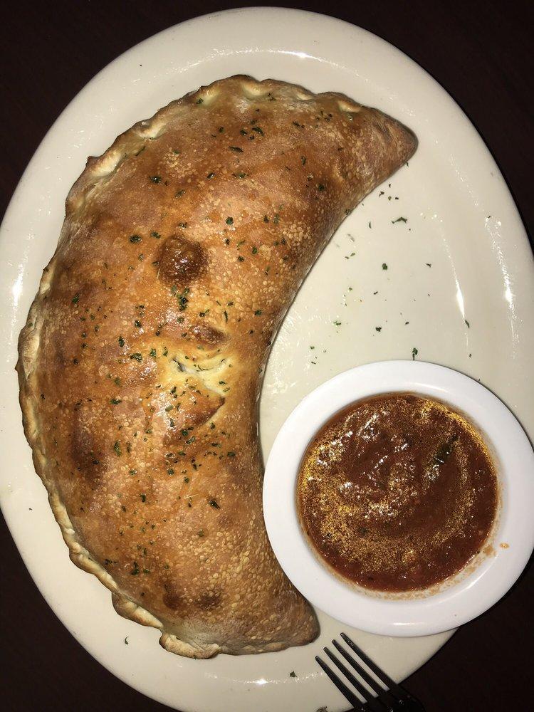 Vegan Calzone · Vegan mozzarella, extra virgin olive oil, Italian herbs, vegan Parmesan, served with house-made marinara. Add toppings for an additional charge.