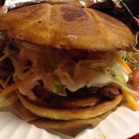 Torta · Grilled Mexican Bun with Mayo, Beans, Choice of Meat, Cheese, Sour Cream, Lettuce, and Pico ...