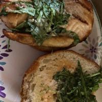 Pacific Sandwich · Grilled salmon on a bun, with arugula, avocado and caper aioli.
