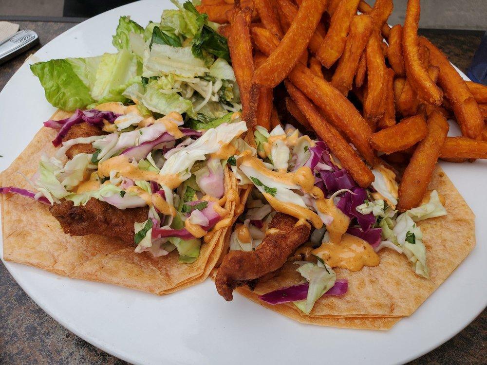 Fish Tacos · Served Baja style, spicy slaw and chipotle aioli, served with a Caesar salad.