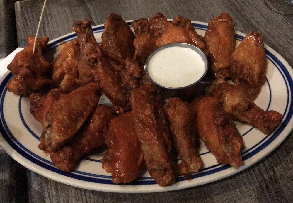 Famous Black Bear Wings · Crispy chicken wings tossed in 1 of our signature sauces with blue cheese or ranch.