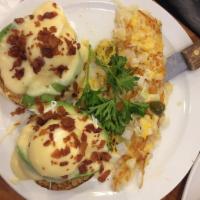 Avocado Benedict · Poached eggs with fresh avocado sliced served on a toasted Eenglish muffin. Topped with crea...