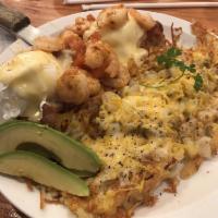Shrimp Benedict · Grilled shrimp with 2 strips of bacon and poached eggs topped with diced tomatoes and hollan...