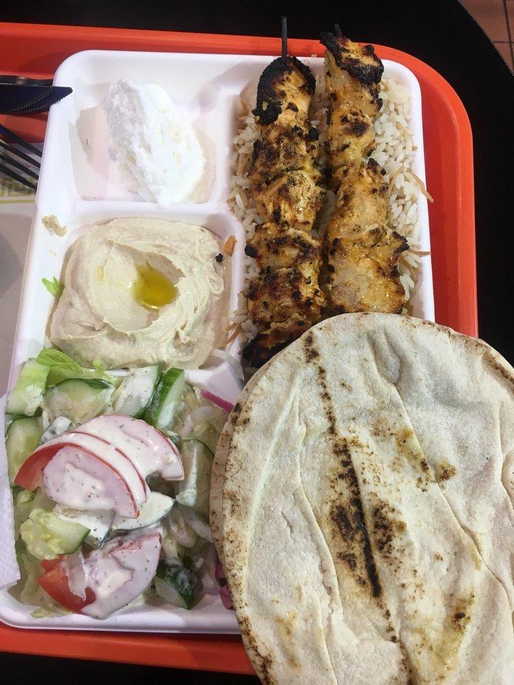Chicken Kabob Plate · Marinated white chicken, served with french fries or rice, salad, hummus, garlic sauce, pickles and 2 pieces of pita bread.