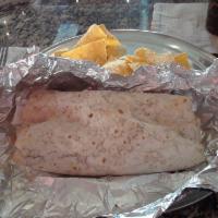 Super Burrito · CHOICE OF MEAT AND BEANS.RICE, AVOCADODO SALSA, GUACAMOLE, PICO DE GALLO, CHEESE AND SOUR CR...