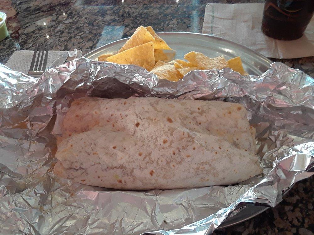 Super Burrito · CHOICE OF MEAT AND BEANS.RICE, AVOCADODO SALSA, GUACAMOLE, PICO DE GALLO, CHEESE AND SOUR CREAM.
