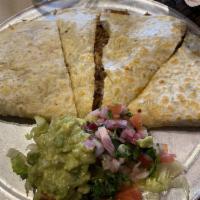 Super Quesadilla · Filled whit cheese, choice of meat or vegetarian then garnished with guacamole and pico de g...
