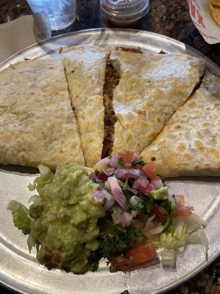 Super Quesadilla · Filled whit cheese, choice of meat or vegetarian then garnished with guacamole and pico de gallo.