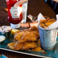 Fish and Chips · Beer battered and fried, served with rustic fries, homemade coleslaw and tartar sauce.
