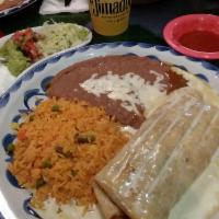 Chimichanga · A flour tortilla filled with your choice of chunks of beef or shredded chicken, deep-fried u...