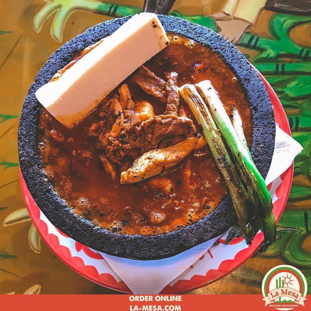 Molcajete · Spicy. Grilled steak, chicken, chorizo, and shrimp sautéed in a special hot sauce, garnished with queso fresco and green onions. Served in a lava rock bowl. Includes 2 sides and tortillas.