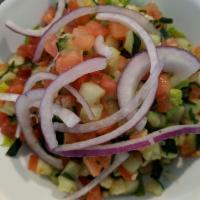 Authentic Israeli Salad · Finely chopped lettuce, cucumber, tomato, red pepper, onion, parsley and mint served with fa...