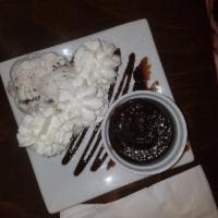 Chocolate Souffle · Hot chocolate cake. Served with ice cream and whipped cream.