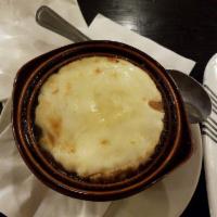 French Onion Soup · With bread and melted cheese.