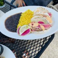Fish Tacos · 3 corn tortillas filled with blackened fresh Mahi, cabbage cilantro slaw and a housemade fis...