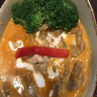 Panang · Sautéed with panang curry paste and garnished with kaffir-lime leaves and coconut milk. Spicy.