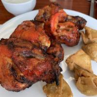 Tandoori Chicken · Chicken Marinated in yoghurt ginger garlic and spices cooked in Clay oven