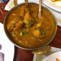 Punjabi Chicken · Chicken cooked in an aromatic gravy of onions, ginger, garlic and tomatoes.