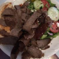 Gyros Plate · A large portion of Gyros served on a bed of rice pilaf and pita bread, and side of Tzatziki ...