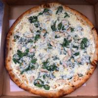 White Pizza · Ricotta cheese base, spinach, grilled chicken and garlic.