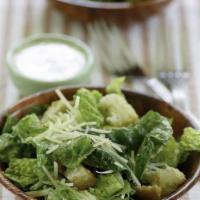 Caesar Salad · Romaine lettuce, tomatoes, croutons and shaved Pecorino cheese with Caesar dressing.